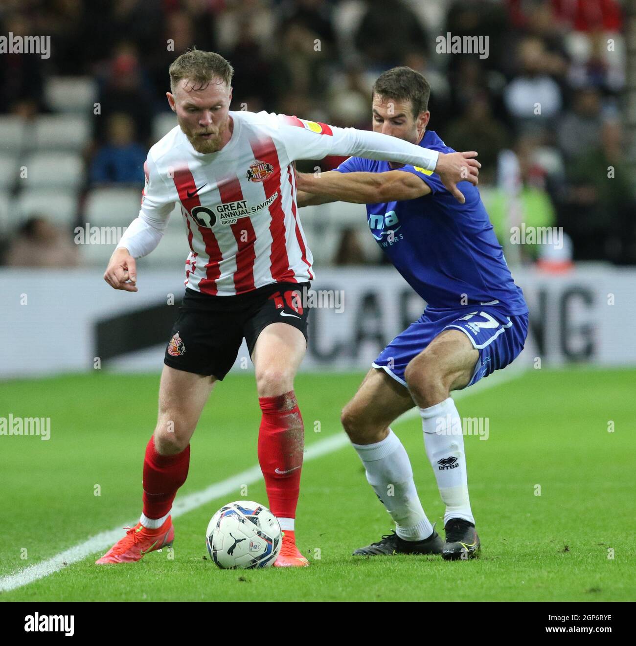 Aiden OBrien of Sunderland and Matty Blair of Cheltenham Town in action  during the Sky Bet League 1 match between Sunderland and Cheltenham Town at  the Stadium Of Light, Sunderland on Tuesday