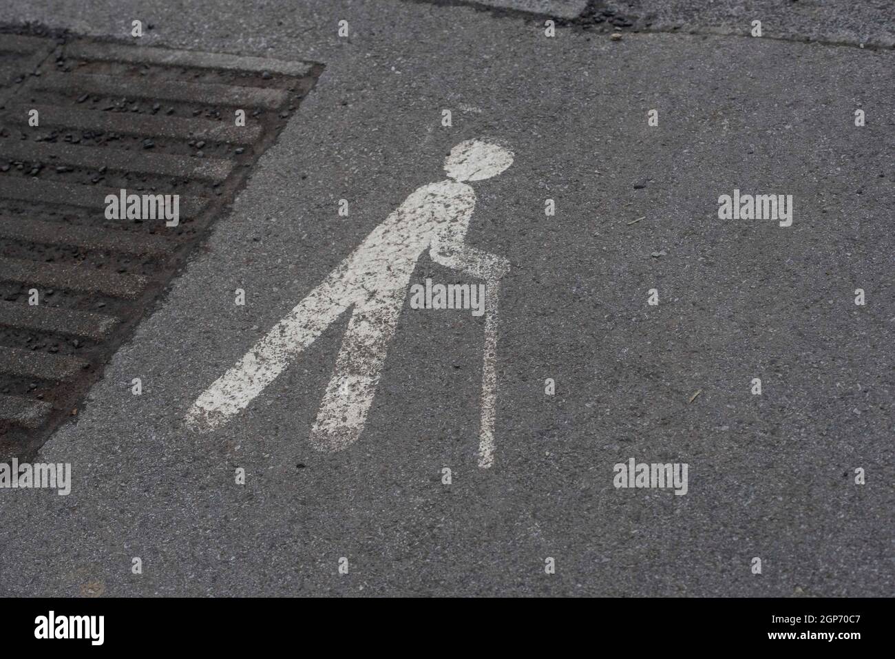 a walking aid and accessibility sign, marking on the street Stock Photo