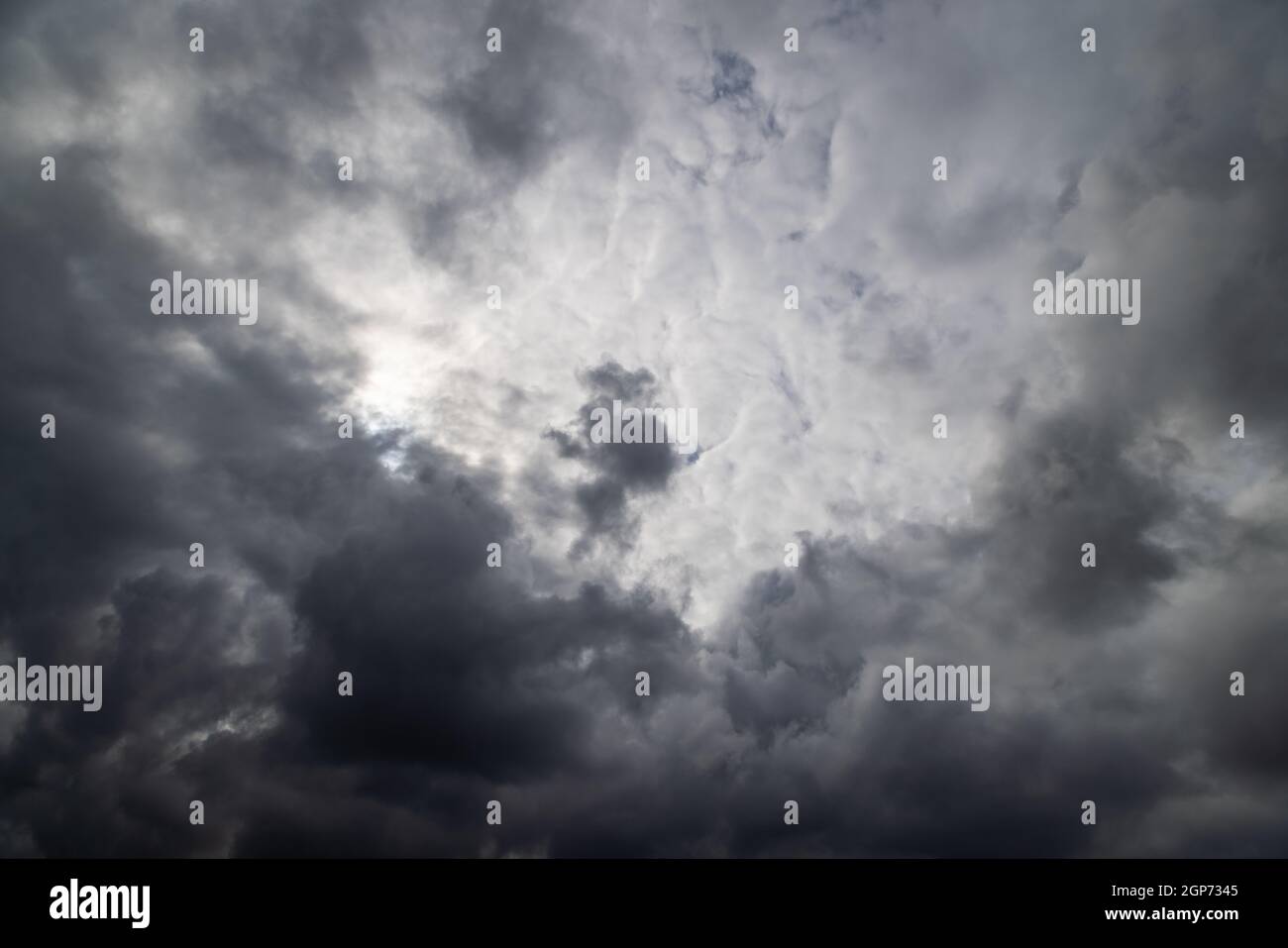 grey incoming storm clouds full frame background Stock Photo