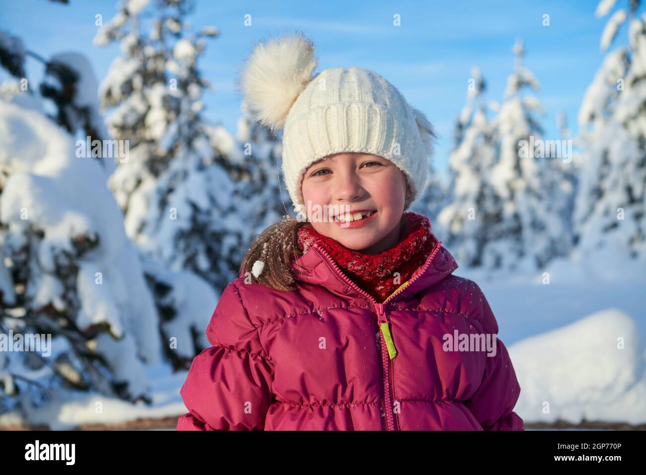 portrait of cute little girl on beautiful winter day with fresh snow ...