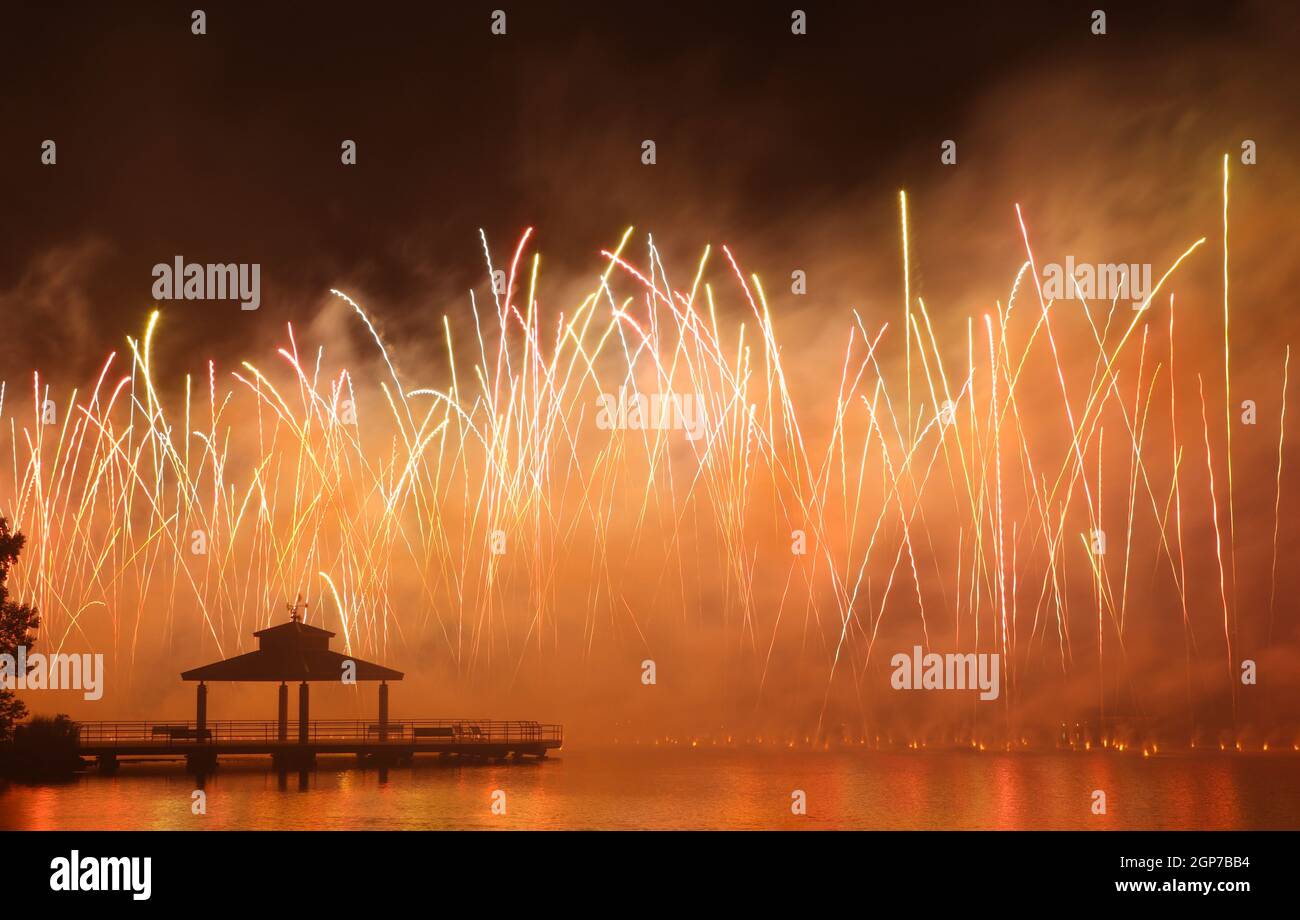 Fireworks at Delco Park. Fishing pier and pavilion silhouette in