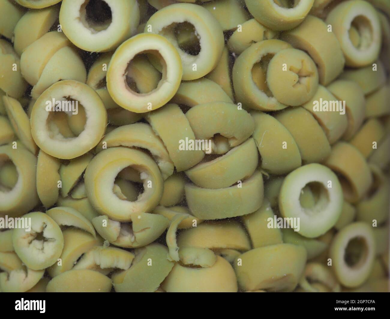 sliced green olives in brine useful as a background Stock Photo Alamy