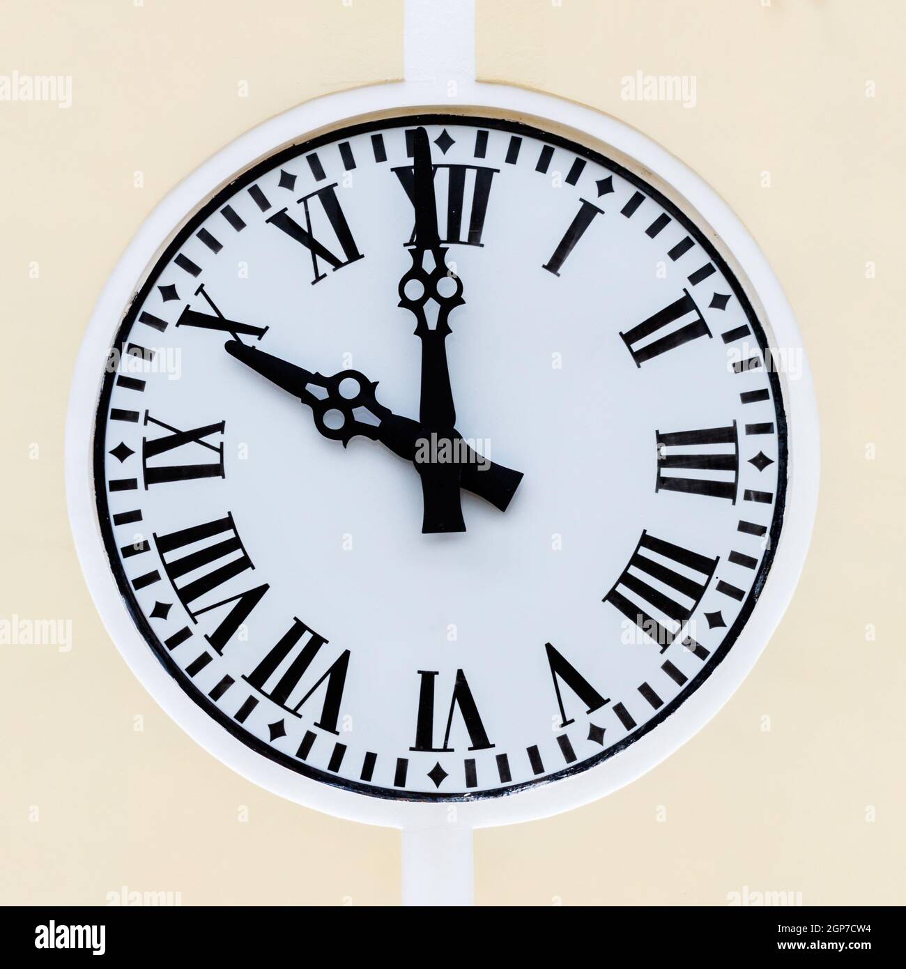 Large wall clock with black numbers Stock Photo Alamy
