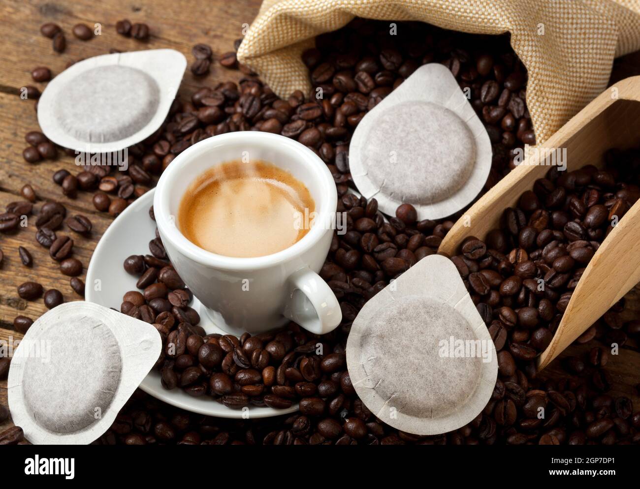 Coffee cups with pods on rustic table Stock Photo