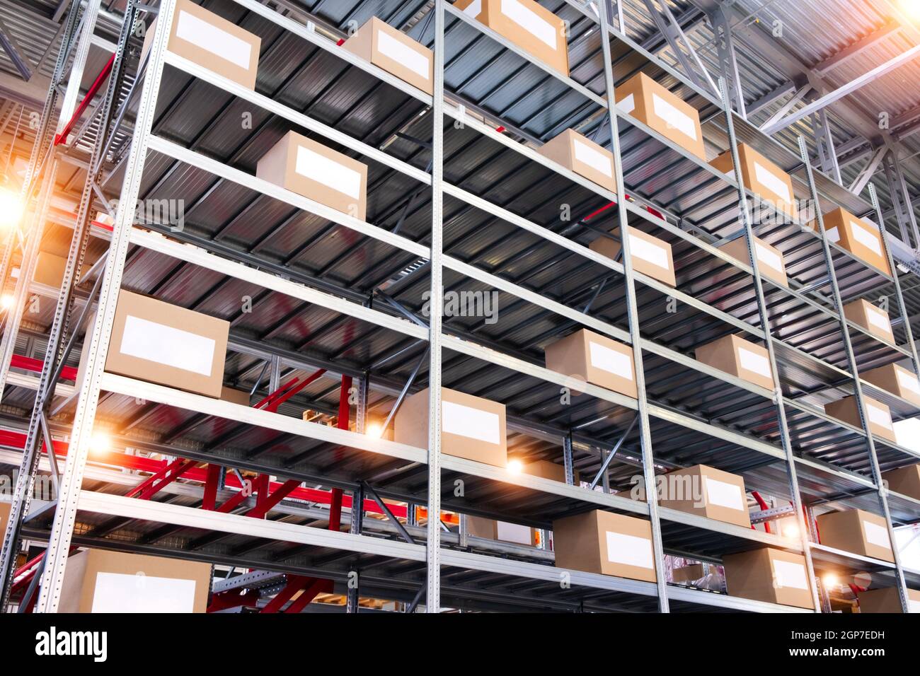 warehouse interior with cardboard boxes on shelves close up Stock Photo ...