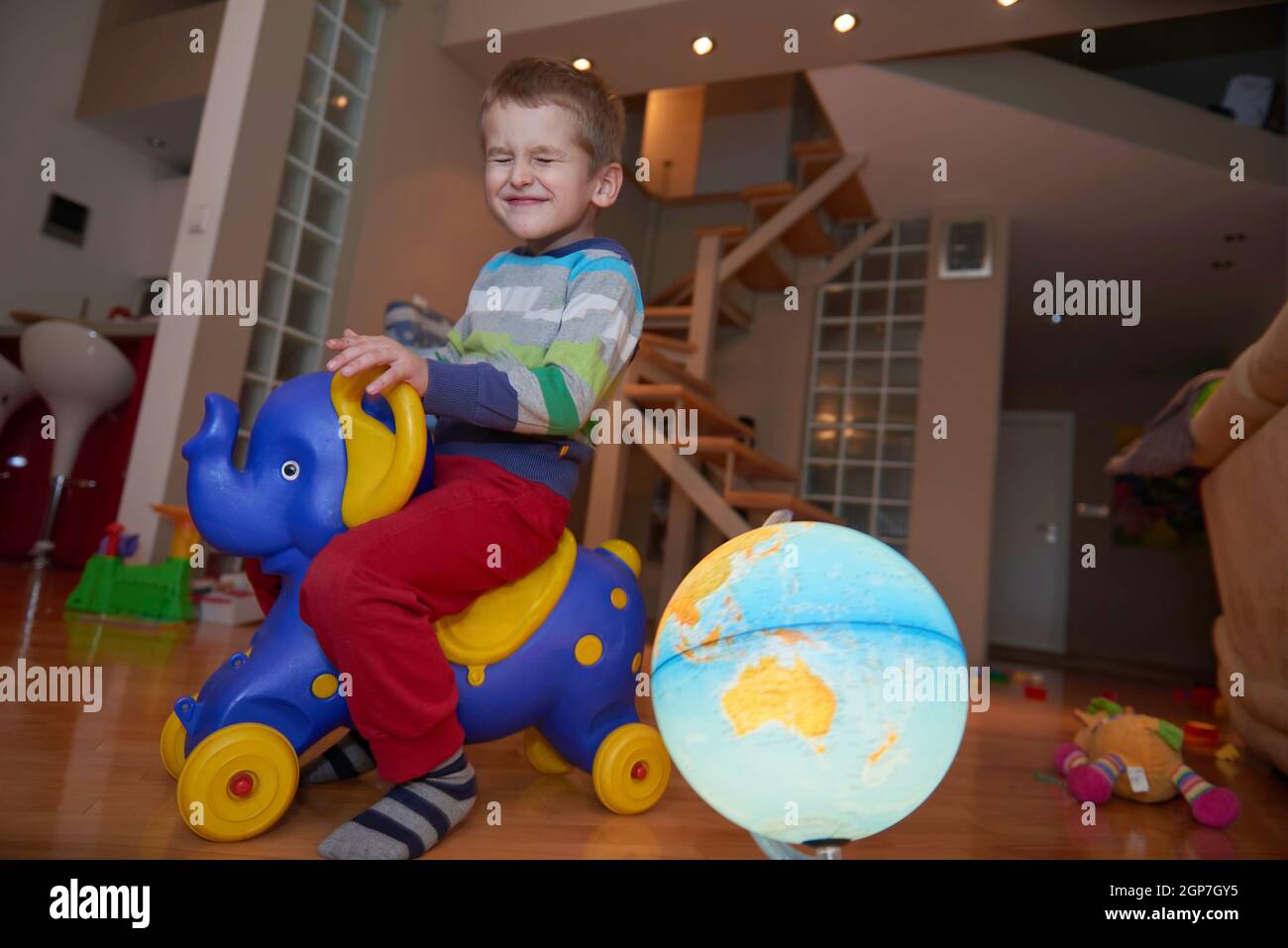 Little boy child playing with creative plastic toys indoor, building ...