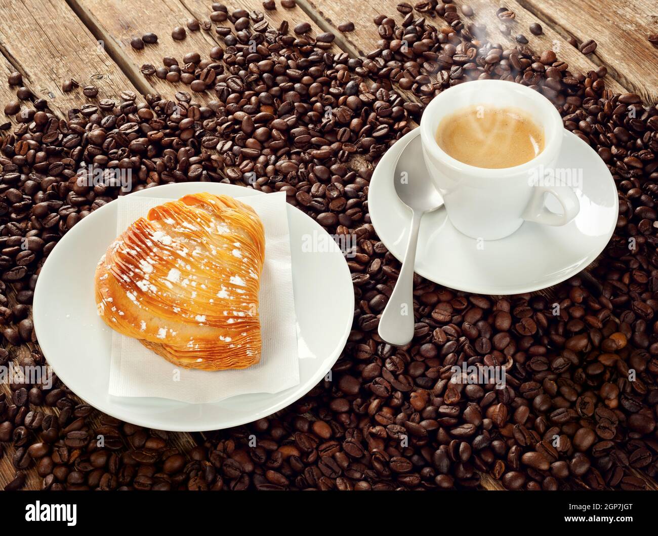 Neapolitan Sfogliatella riccia with cup of espresso coffee Stock Photo