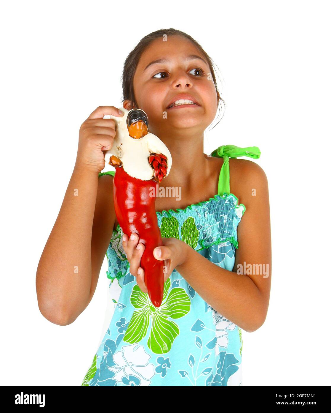 Little girl with neapolitan superstitious object on white background Stock Photo