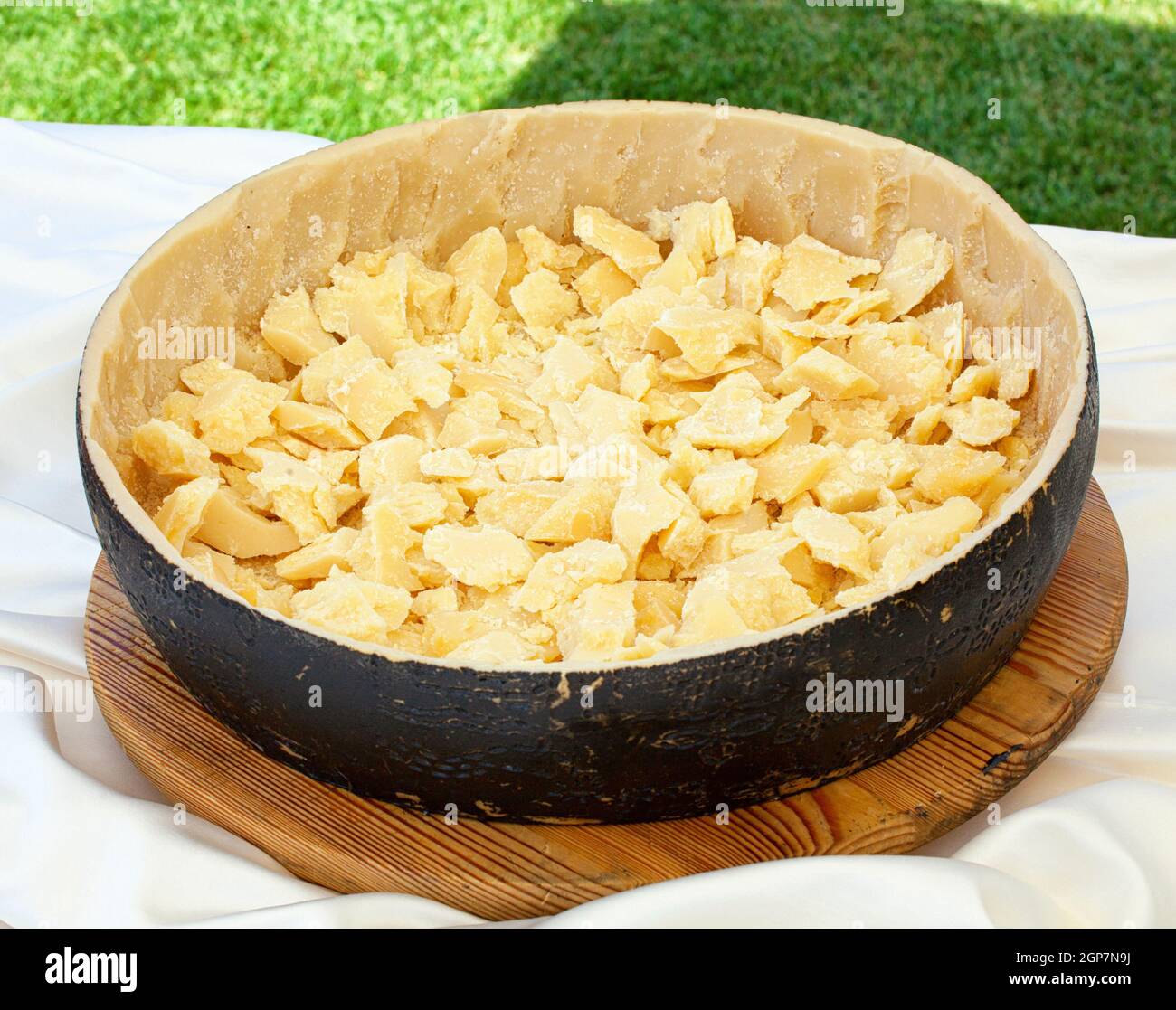 Pieces of parmesan cheese in an empty cheese shell Stock Photo Alamy