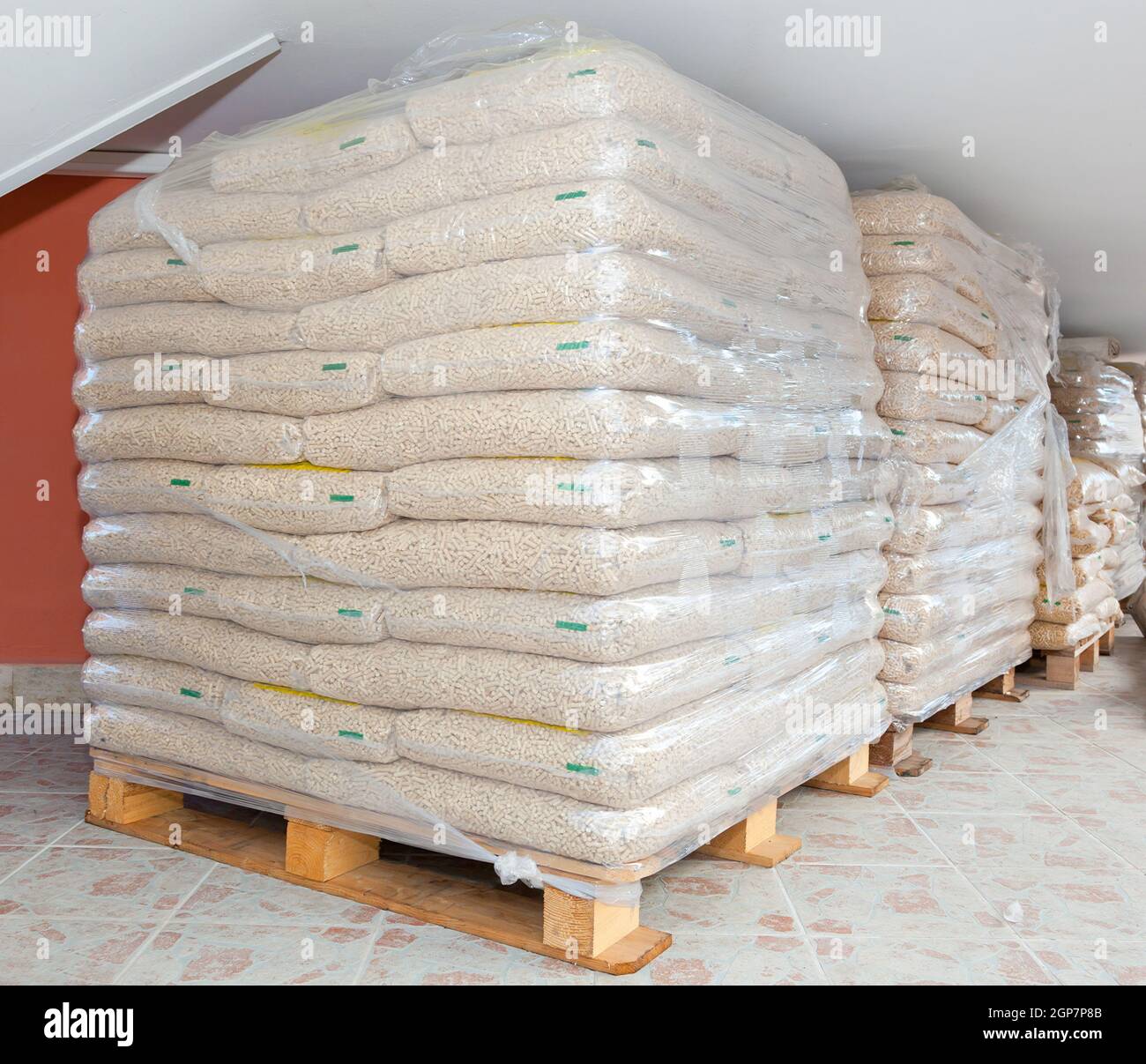 Pallets of wood pellets in plastic bags Stock Photo Alamy