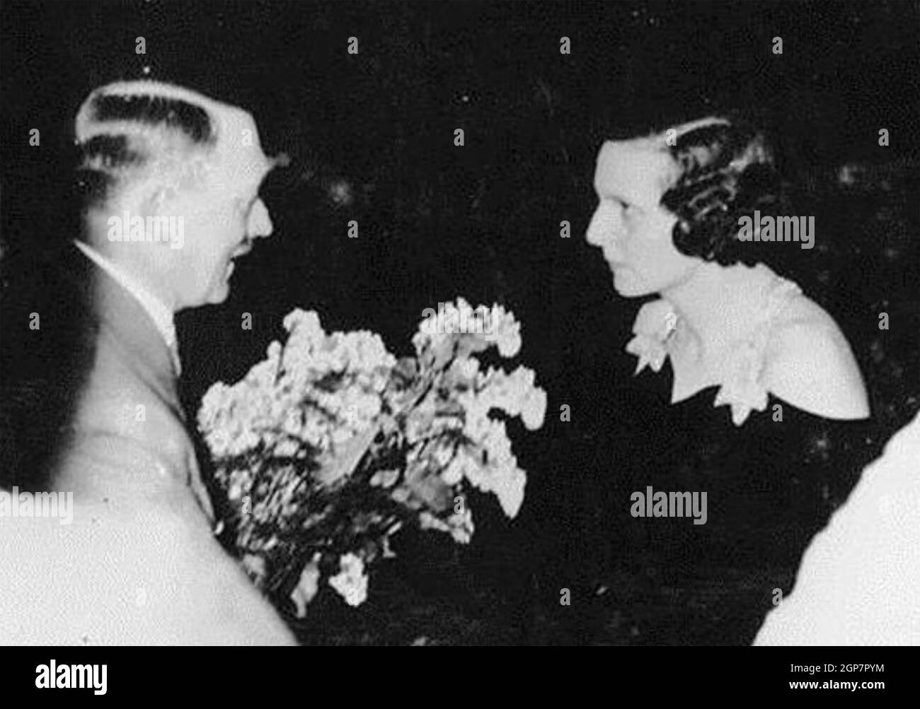 LENI RIEFENSTAHL (1902-2003) German film director and actress is congratulated by Adolf Hitler on her 1938 film  Olympia celebrating the Summer Olympics in Berlin in 1936. Stock Photo