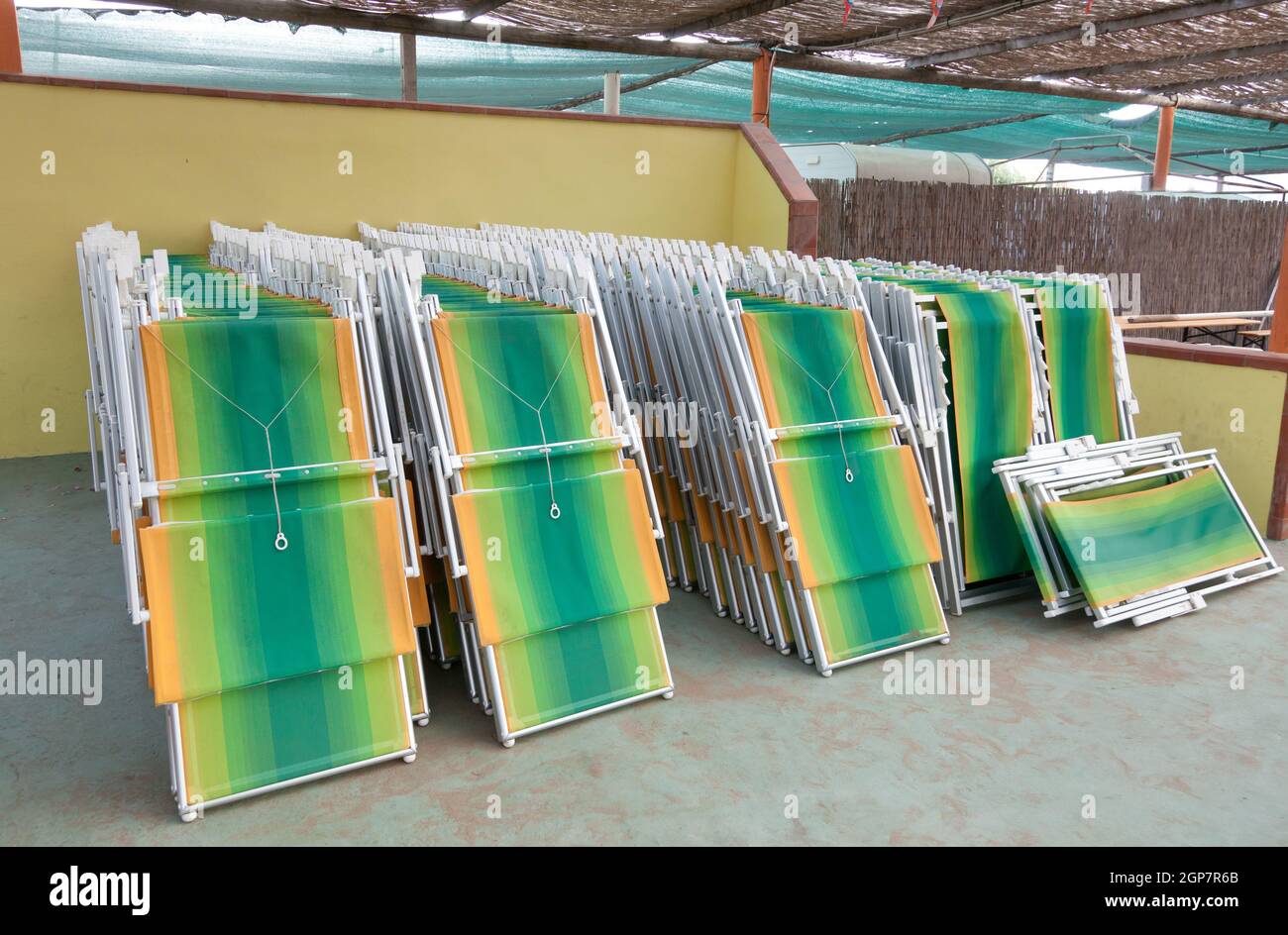 Closed sunbeds in the bathhouse. Ready to use for the start of summer