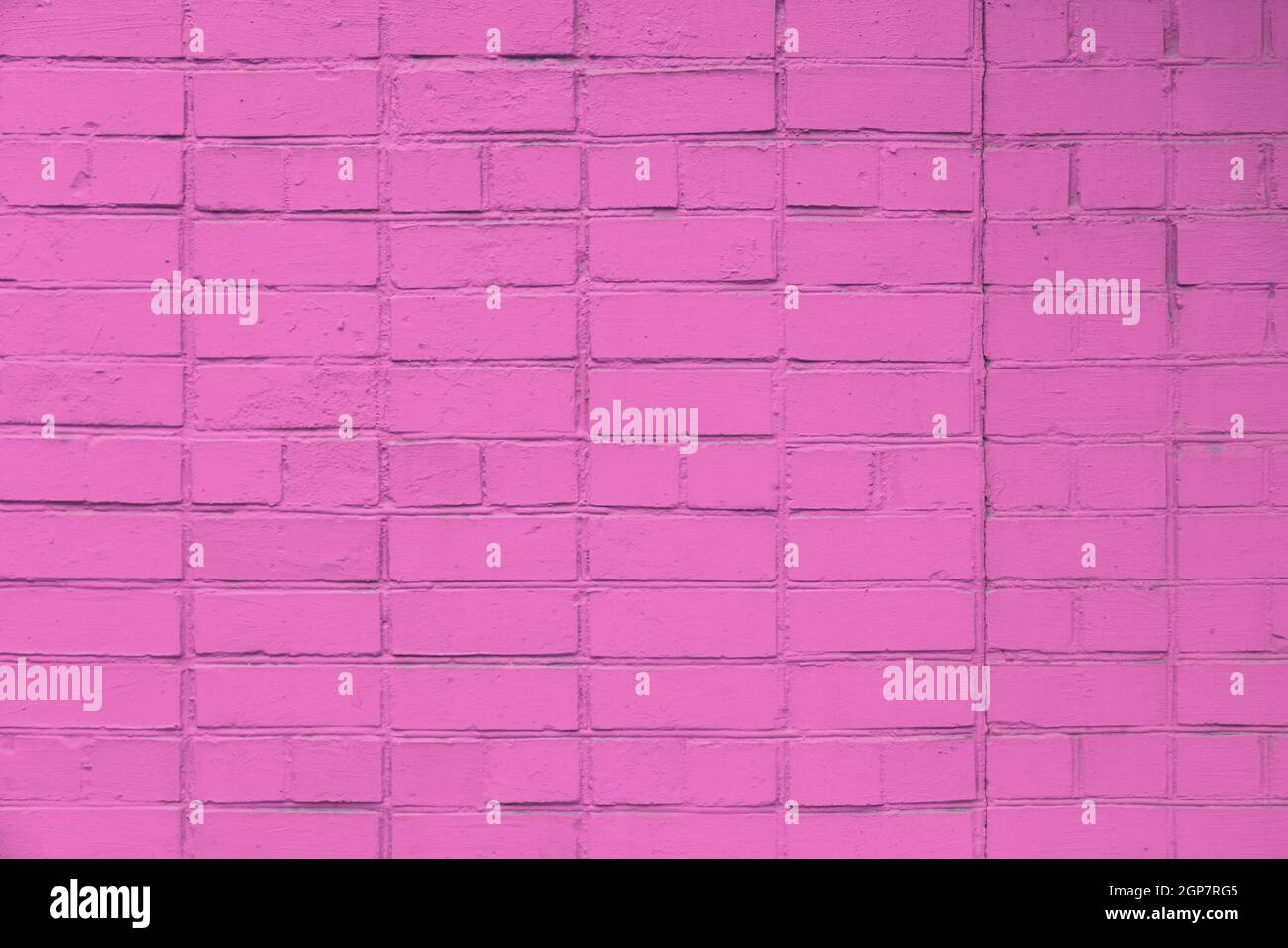 matte pink painted brick wall full frame flat background and texture Stock Photo