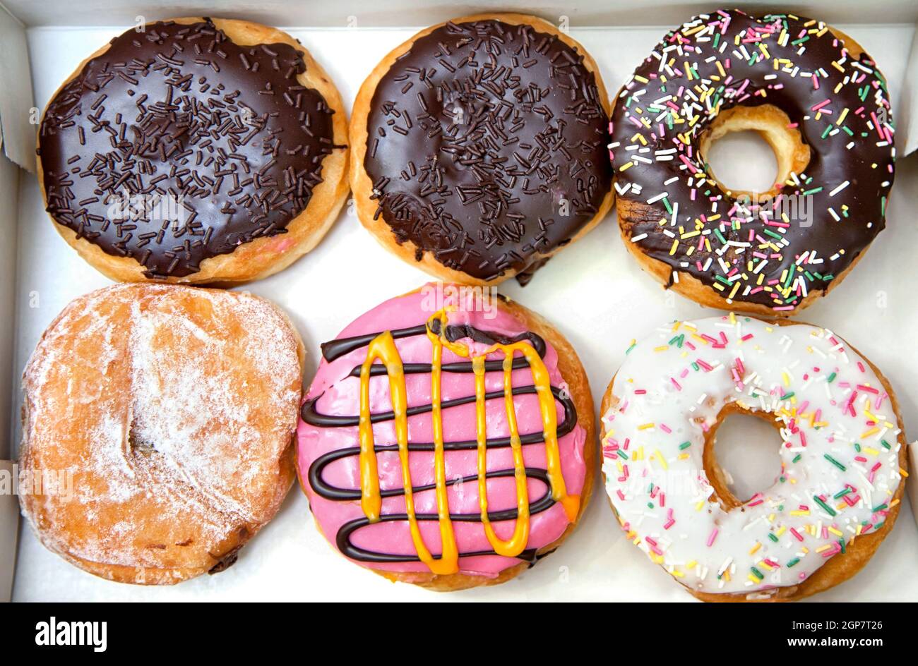 Box full of doughnuts, half a dozen donuts Stock Photo Alamy