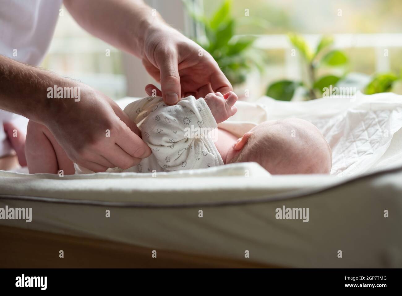 Caucasian father changing baby girl clean cloth Stock Photo Alamy