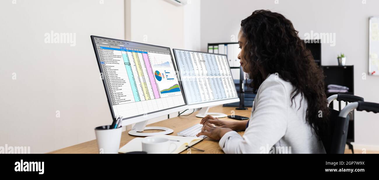 Business Data Analyst Working With Spreadsheet On Computer Stock Photo