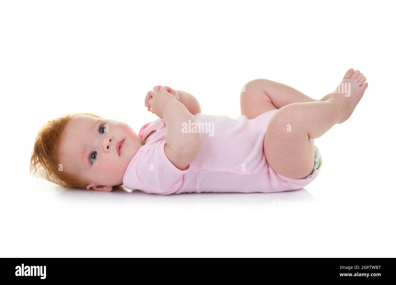 Cute baby girl lying on white background Stock Photo - Alamy