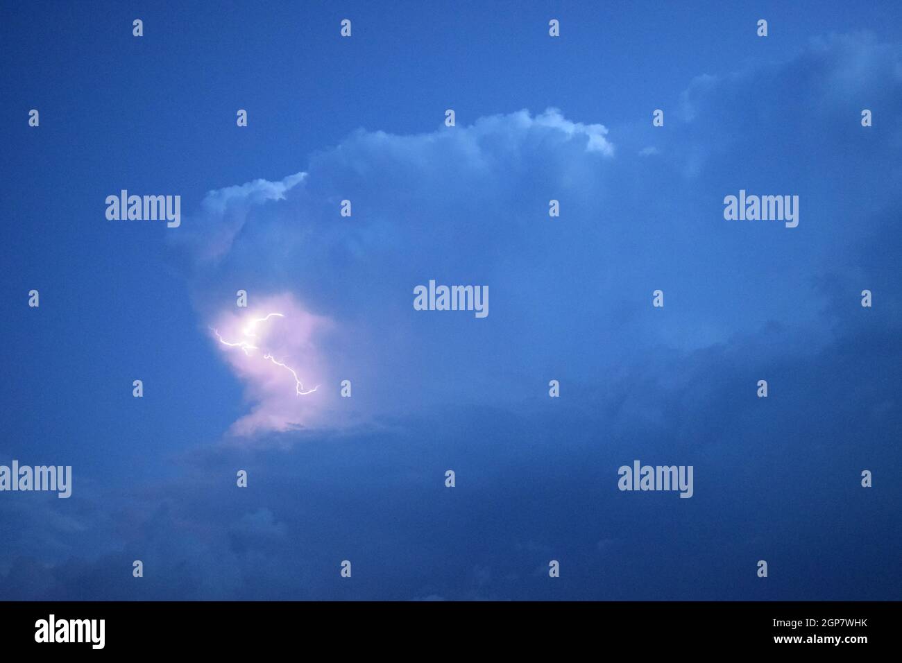 Lightnings in storm clouds. Peals of a thunder and the sparkling ...