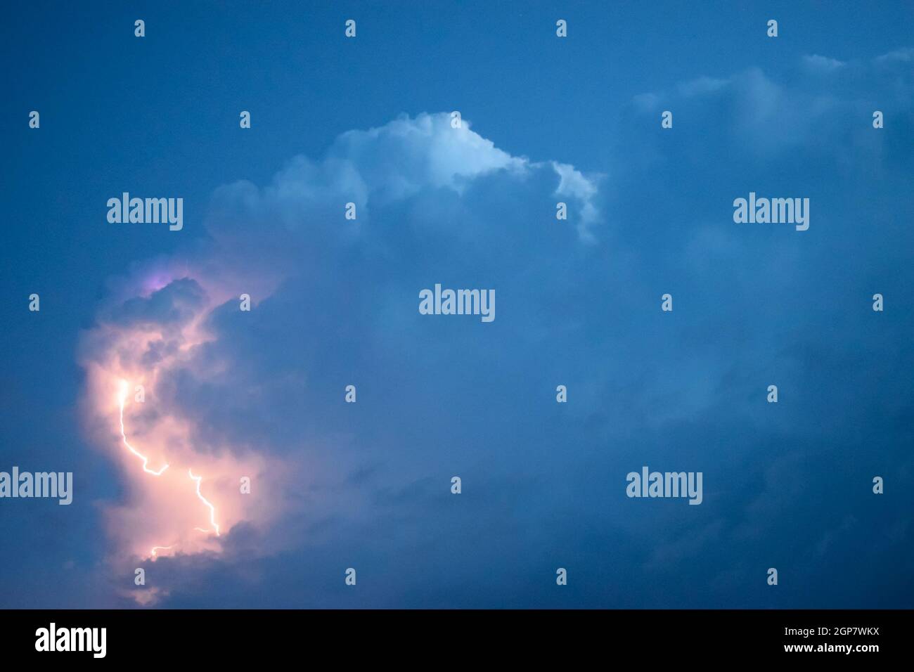 Lightnings in storm clouds. Peals of a thunder and the sparkling ...