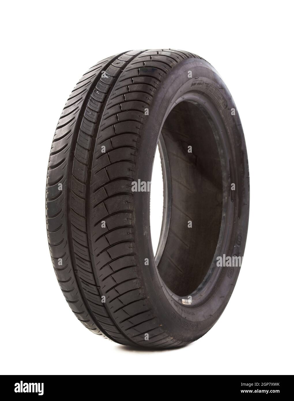 Tire that is nearing the end of it's useful life on a white background