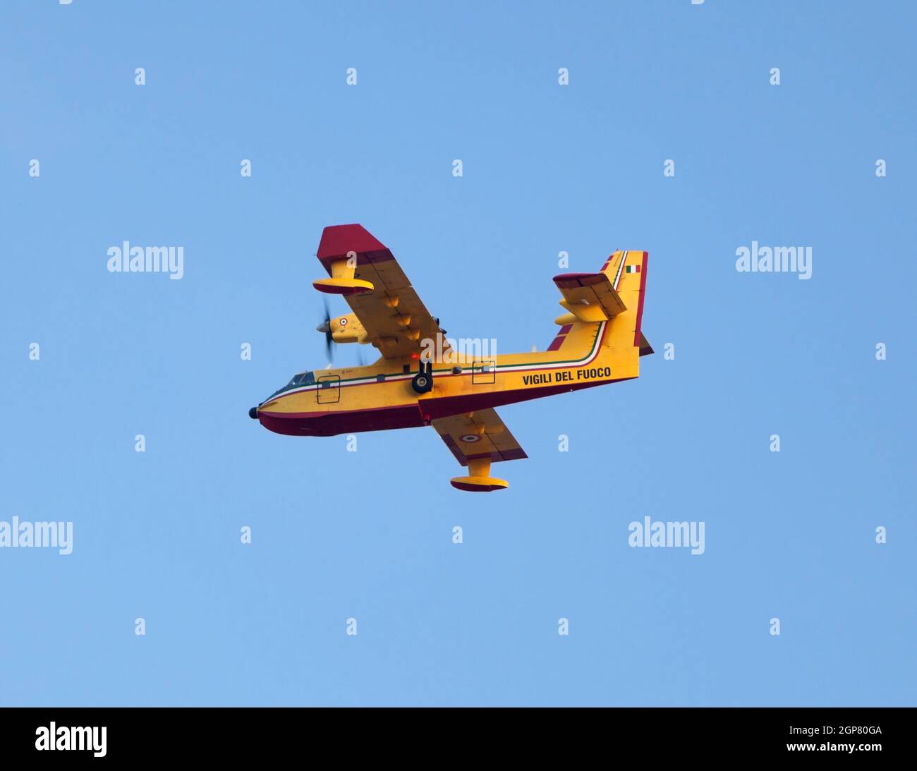 Aerial firefighting. Aircraft preparing to collect sea water. Stock Photo