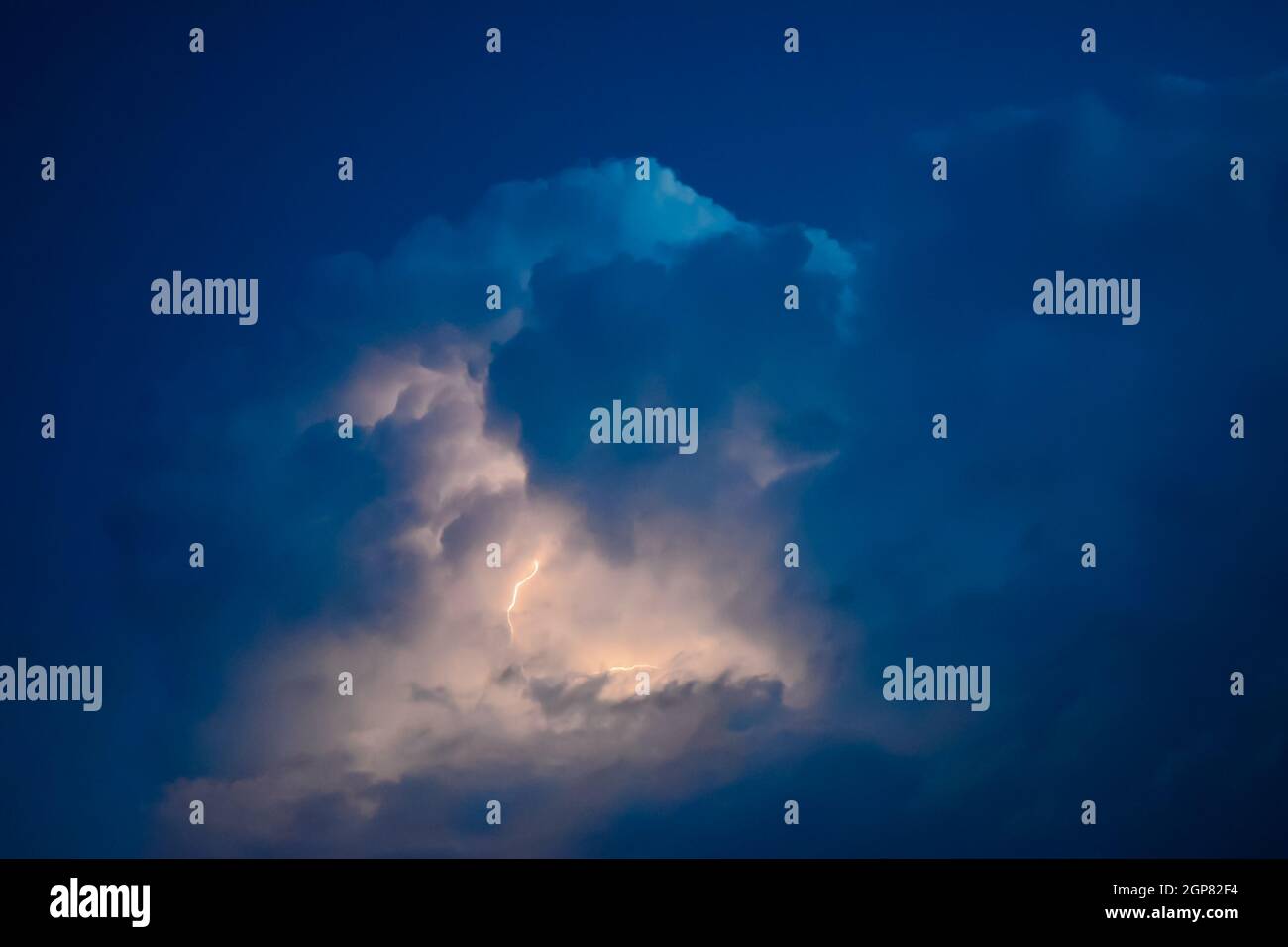 Lightnings in storm clouds. Peals of a thunder and the sparkling ...