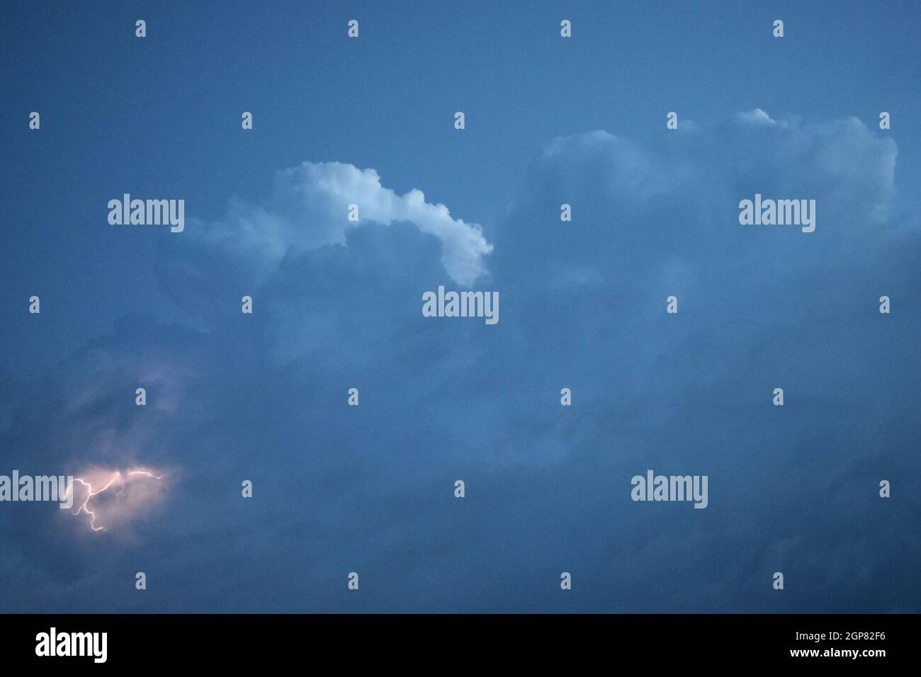 Lightnings in storm clouds. Peals of a thunder and the sparkling ...