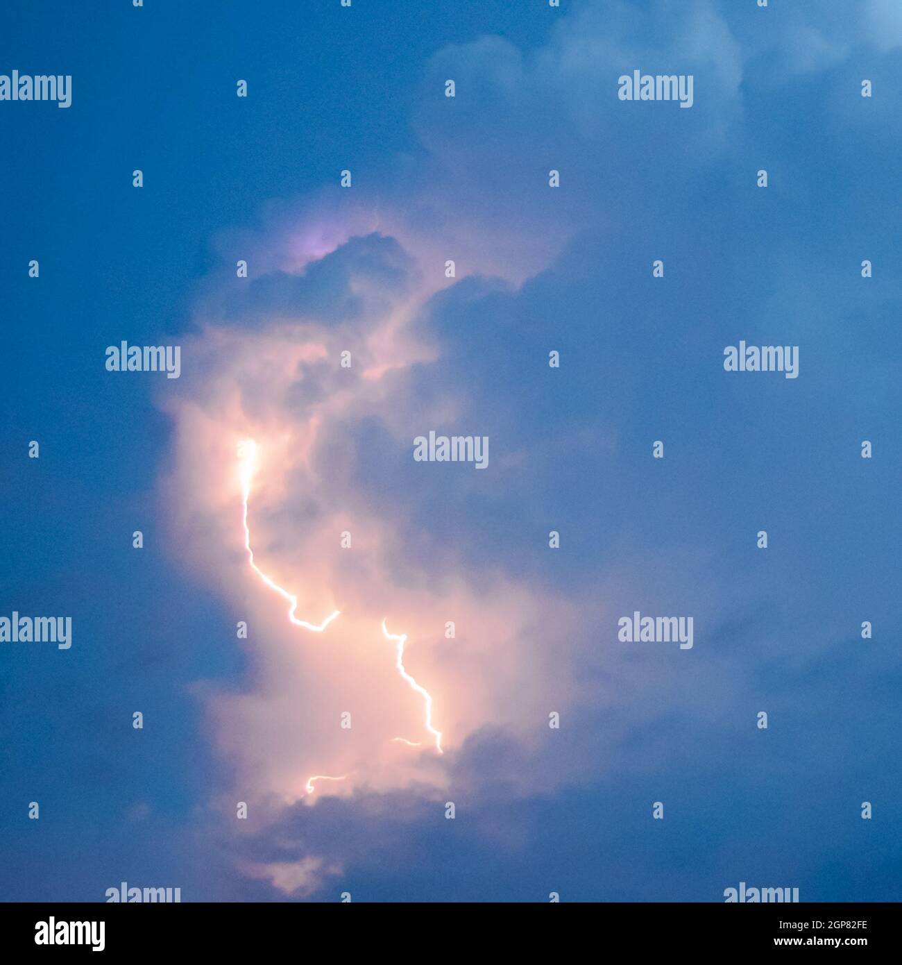 Lightnings in storm clouds. Peals of a thunder and the sparkling ...