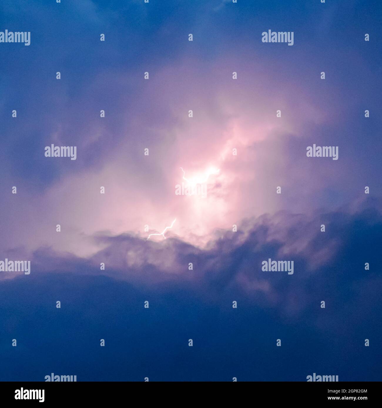Lightnings in storm clouds. Peals of a thunder and the sparkling ...
