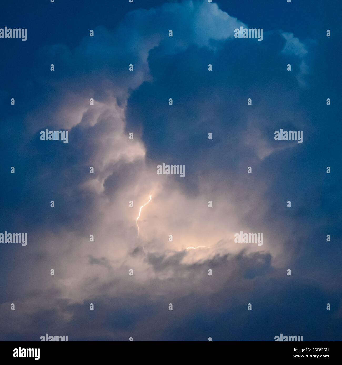 Lightnings in storm clouds. Peals of a thunder and the sparkling ...