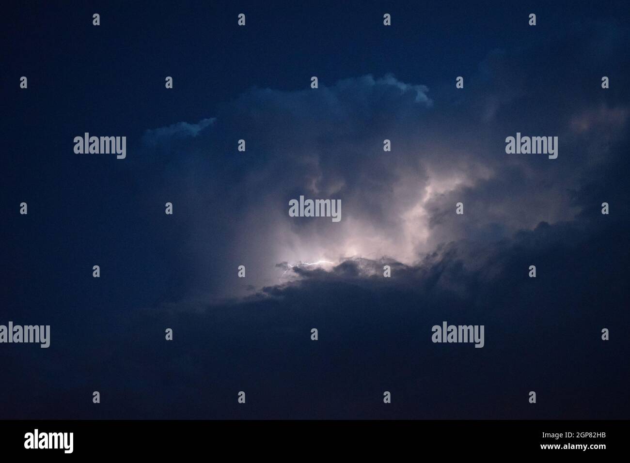 Lightnings in storm clouds. Peals of a thunder and the sparkling ...
