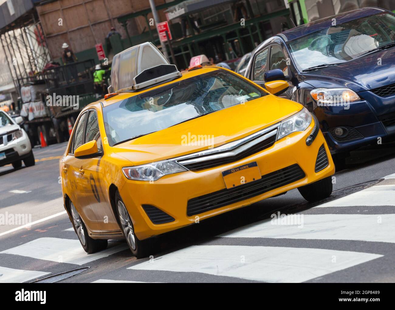 Yellow cab in Manhattan, NYC. The taxicabs of New York City are widely recognized icons of the city. Stock Photo