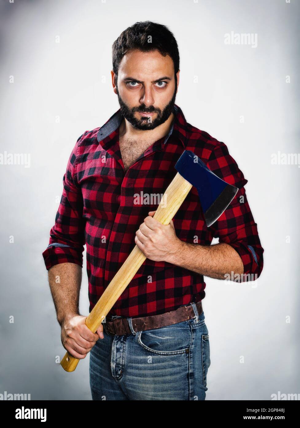 Lumberjack with plaid shirt in dark style Stock Photo - Alamy