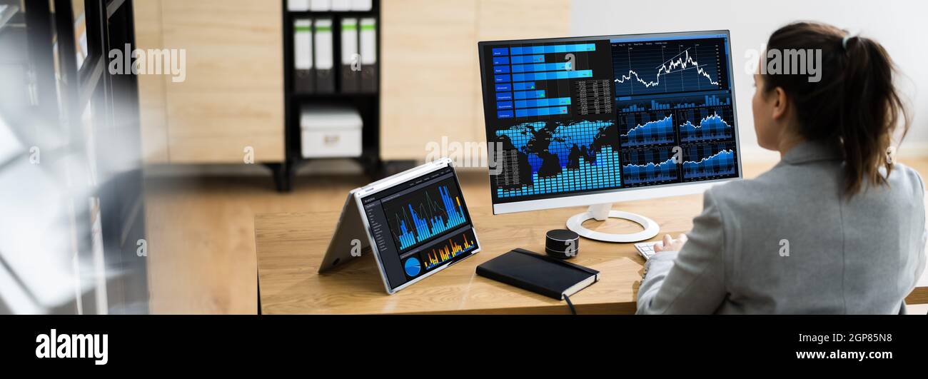 Business Woman Analyst Using KPI Data On Computer Stock Photo
