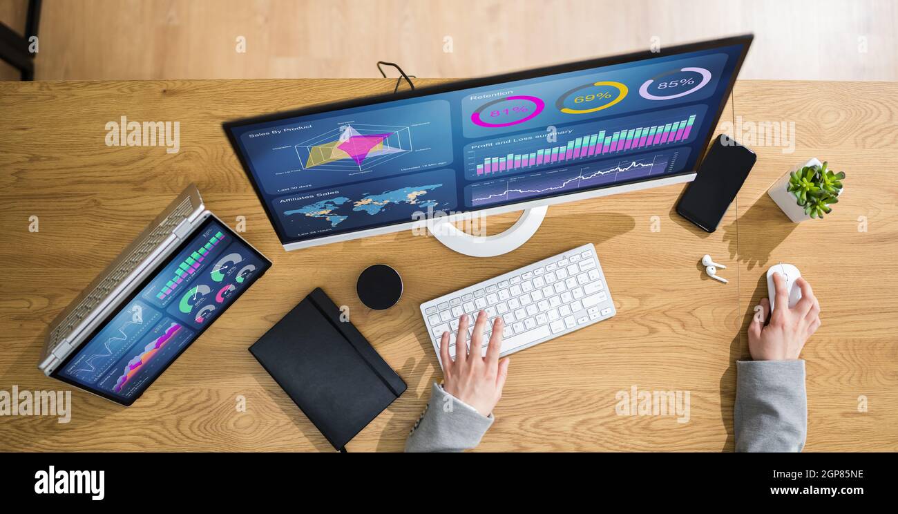 Business Woman Analyst Using KPI Data On Computer Stock Photo