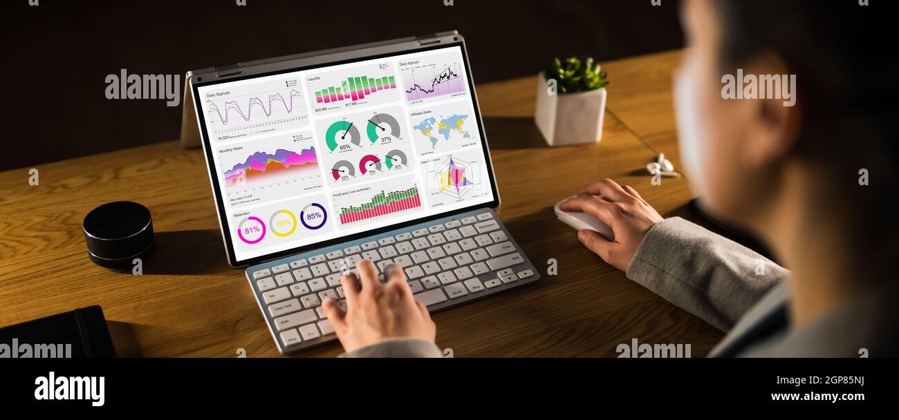 Business Woman Analyst Using KPI Data On Computer Stock Photo