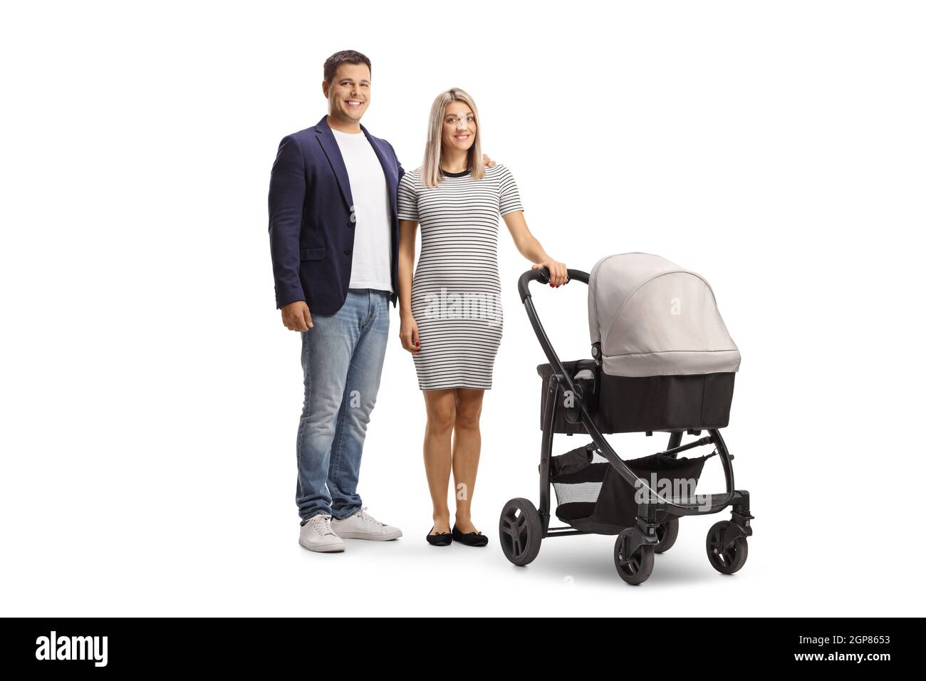 Full length shot of a young casual couple with a baby stroller looking at camera isolated on white background Stock Photo