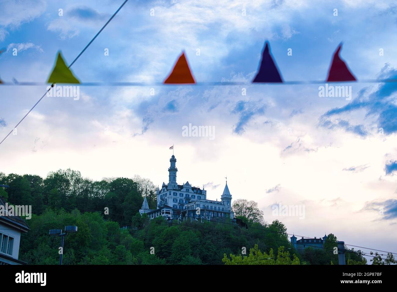 Low angle shot of Gutsch castle over Lucerne under the cloudy sky Stock Photo