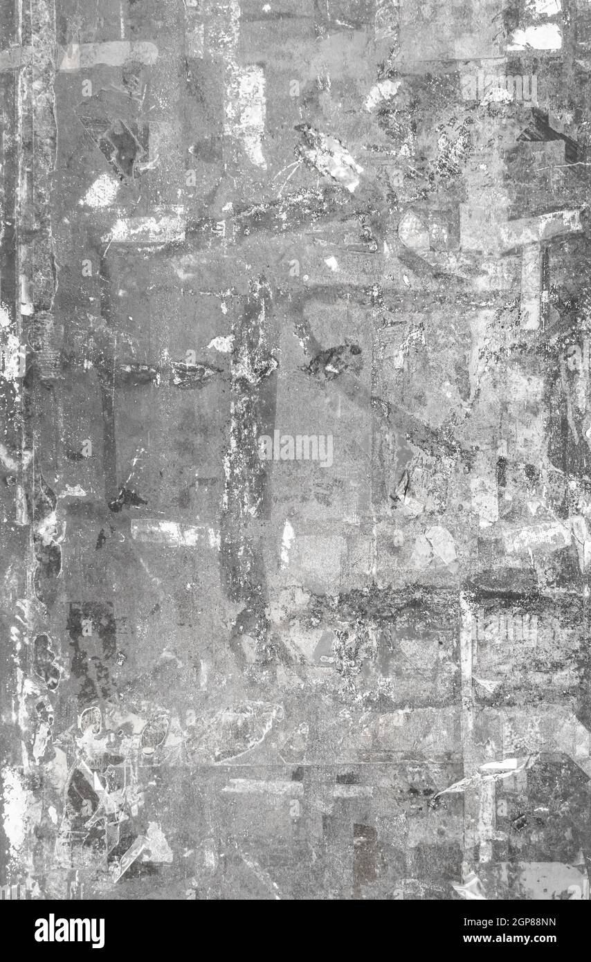 Ripped posters. Paper remaining on advertisement billboard. Grunge ...