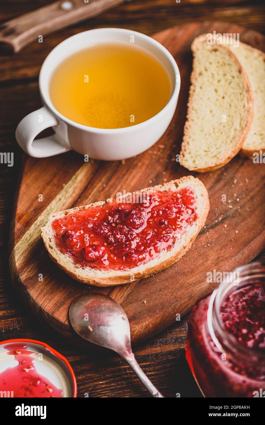 Toast with homemade raspberry jam with cup of green tea Stock Photo - Alamy