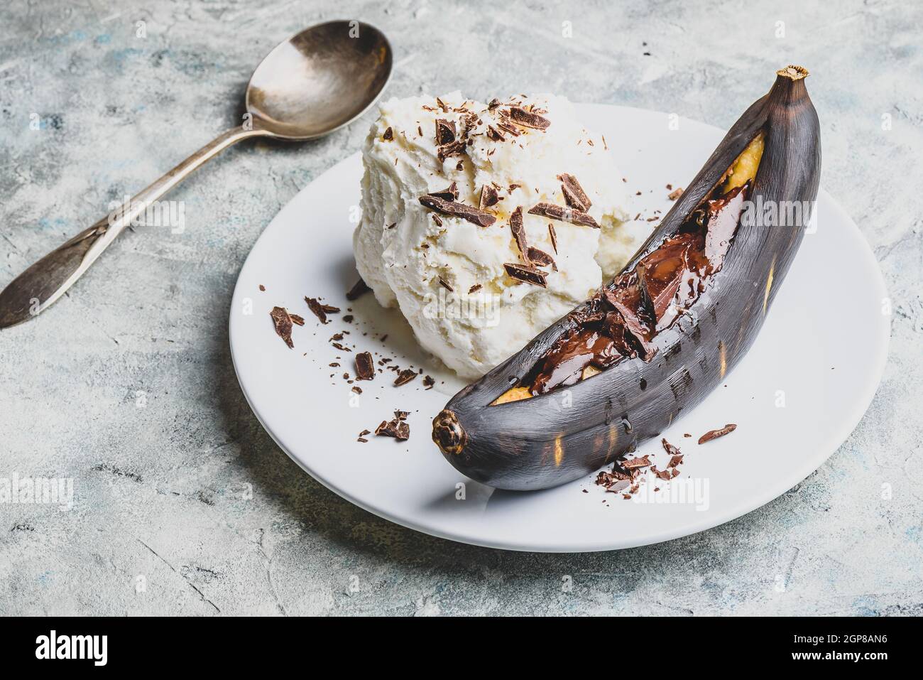 Sweet dessert. Grilled banana with dark chocolate, citrus juice and