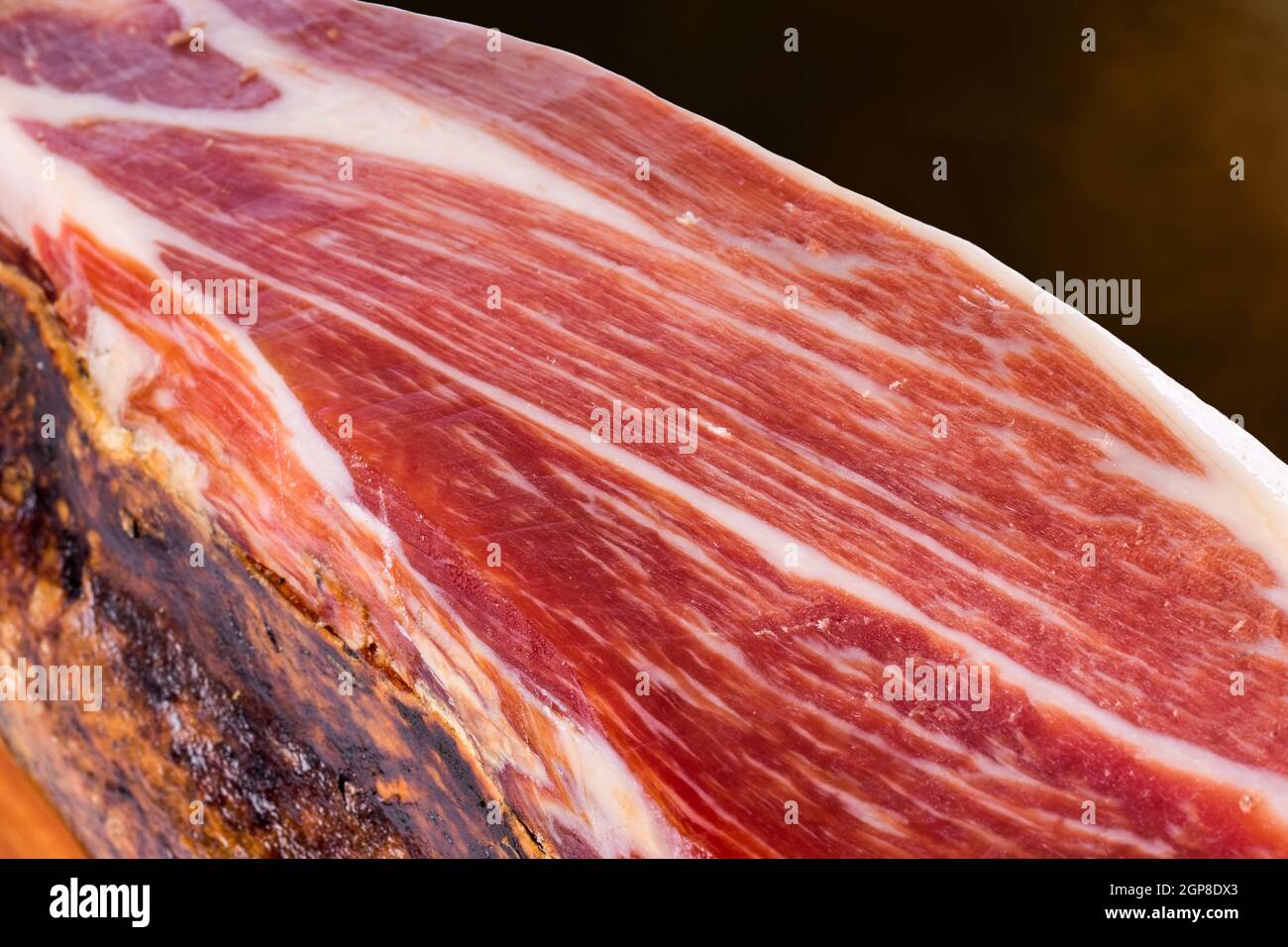 Macro close up of cured Spanish Iberian Bellota pork ham. Stock Photo