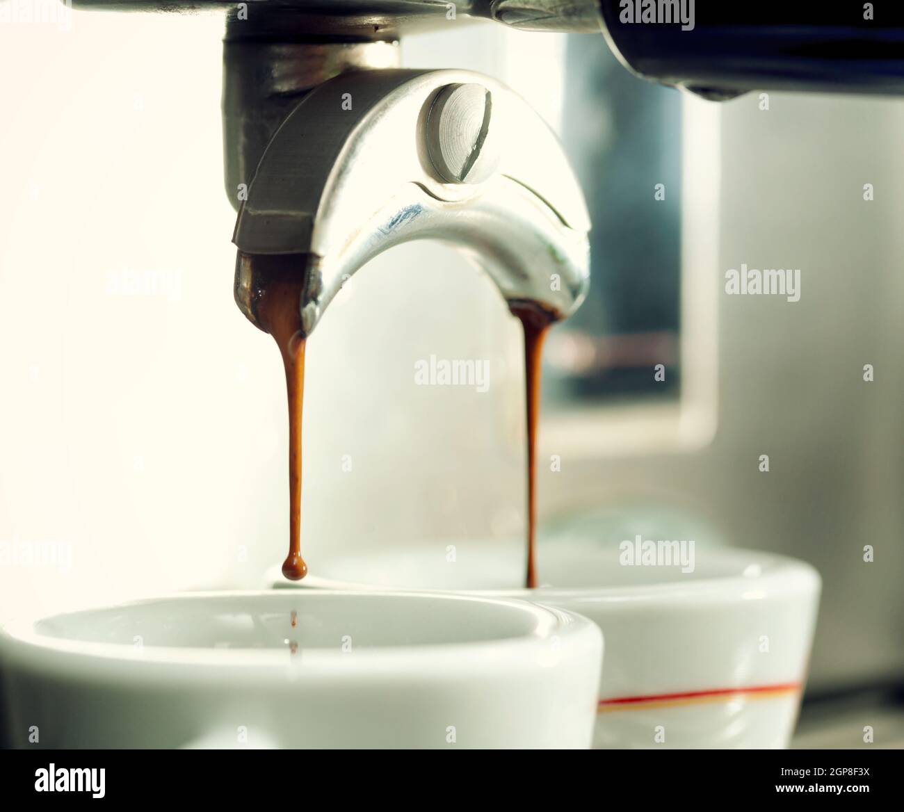 https://c8.alamy.com/comp/2GP8F3X/close-up-of-an-espresso-machine-making-a-cup-of-coffee-2GP8F3X.jpg