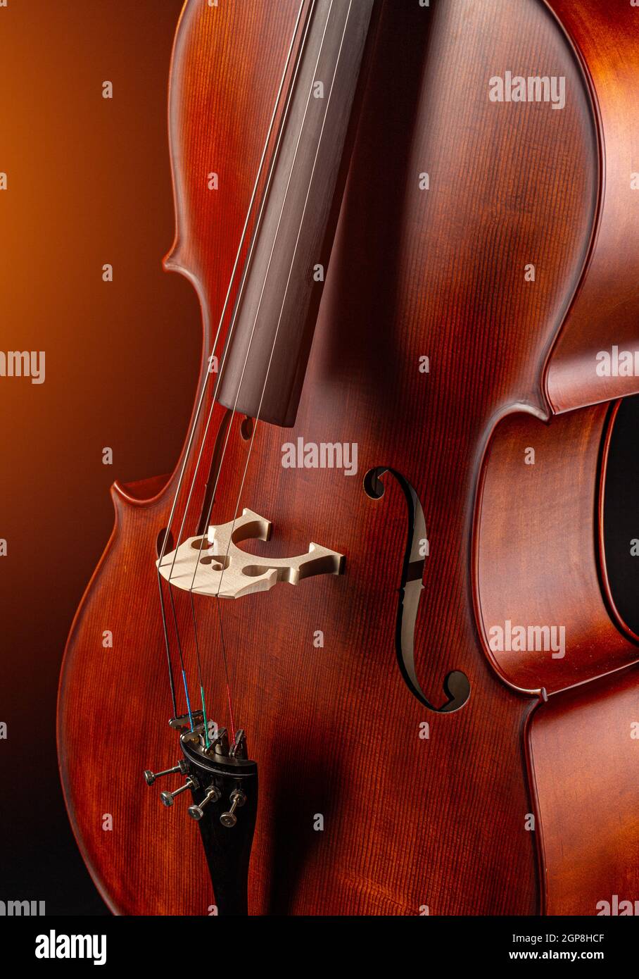 Classic stringed musical instrument, cello on dark background Stock