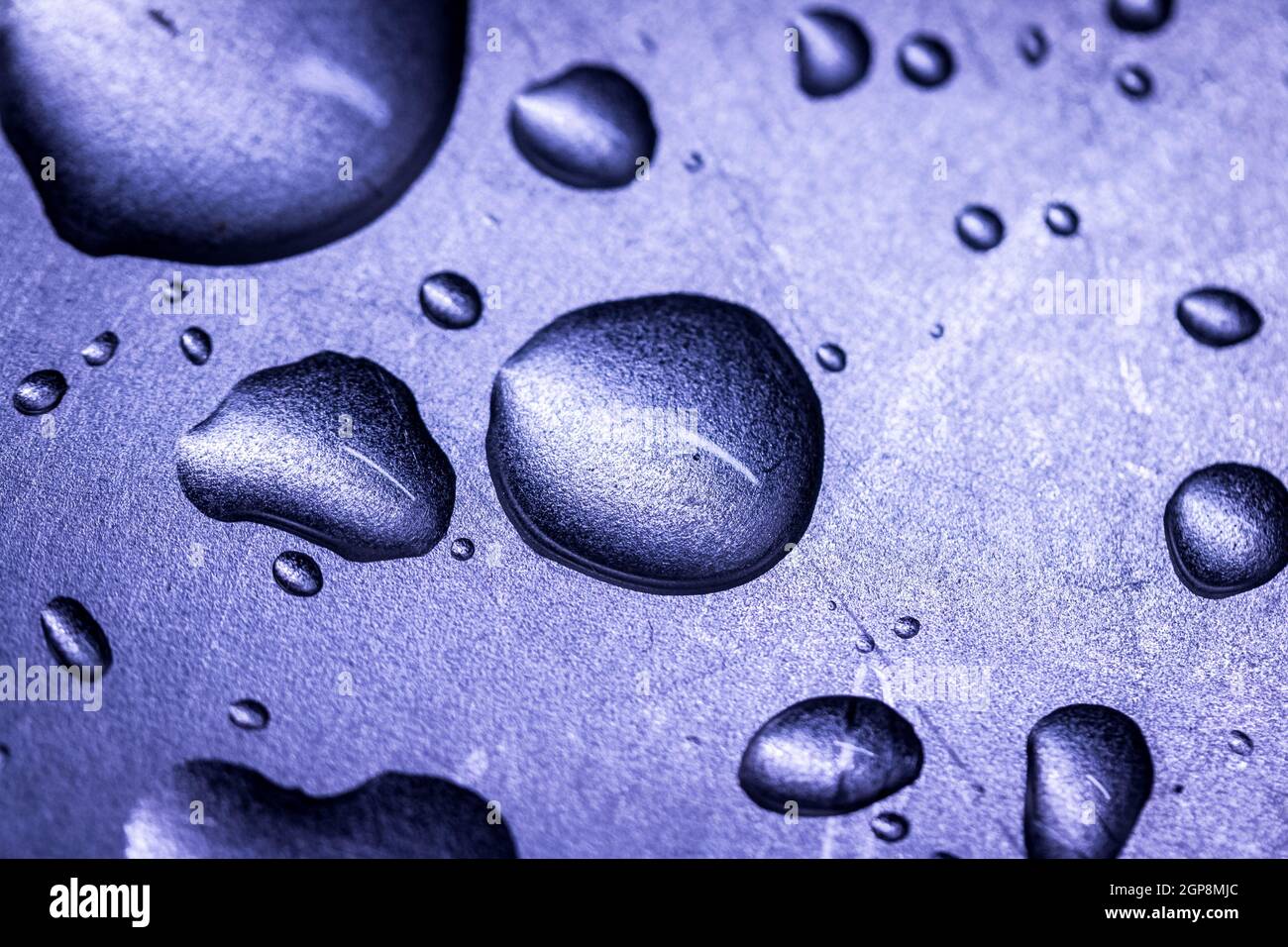 Macro picture of water drops on a metal surface Stock Photo - Alamy