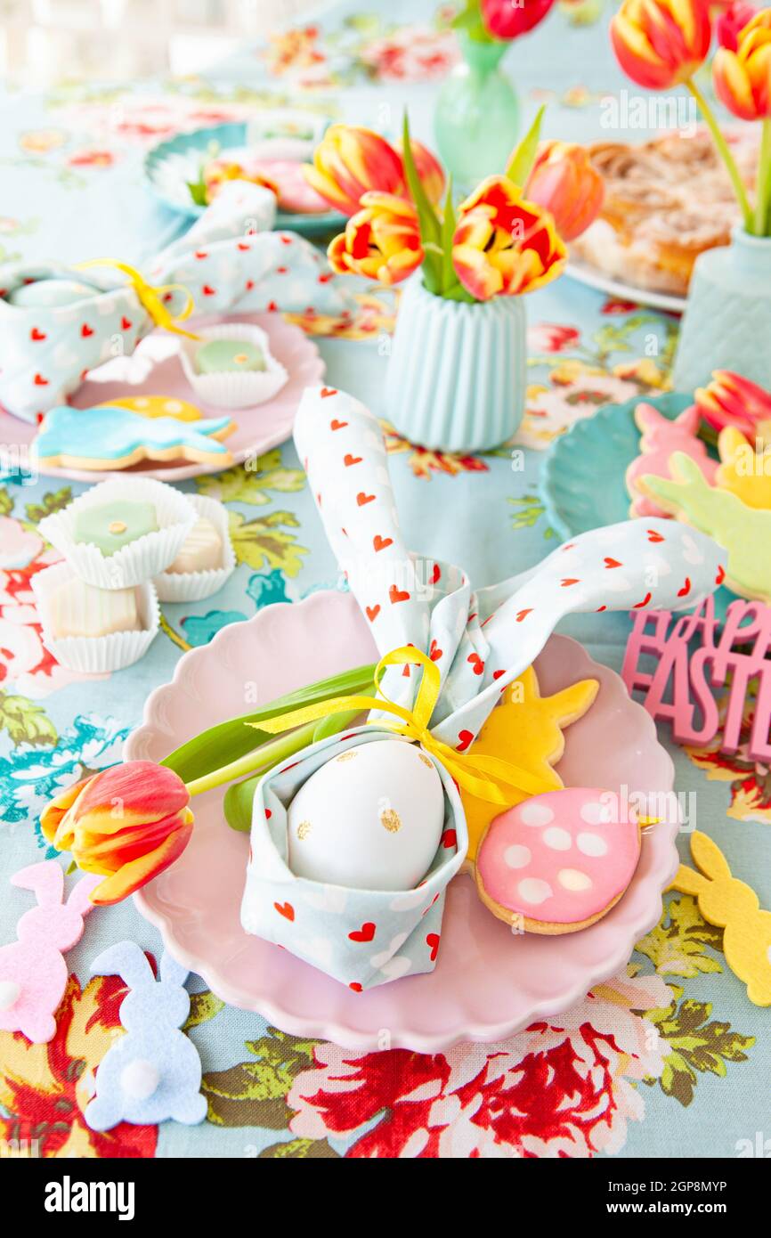 Colorful table setting with sweets for Easter Stock Photo