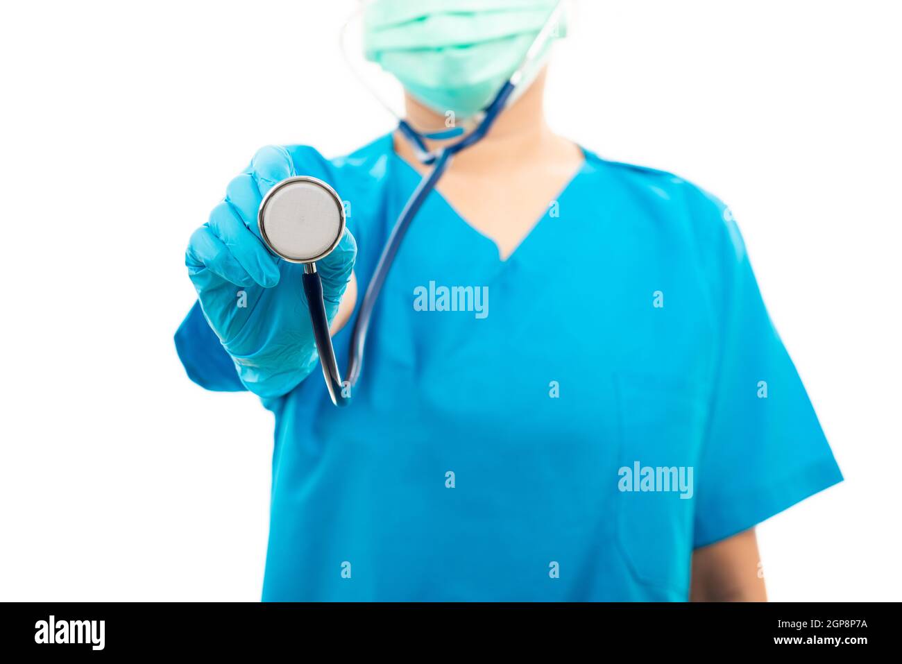 Female nurse puts on rubber gloves and wearing medical face mask, woman