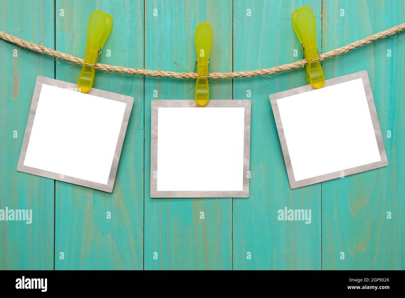Empty picture frames hanging on rope Stock Photo Alamy