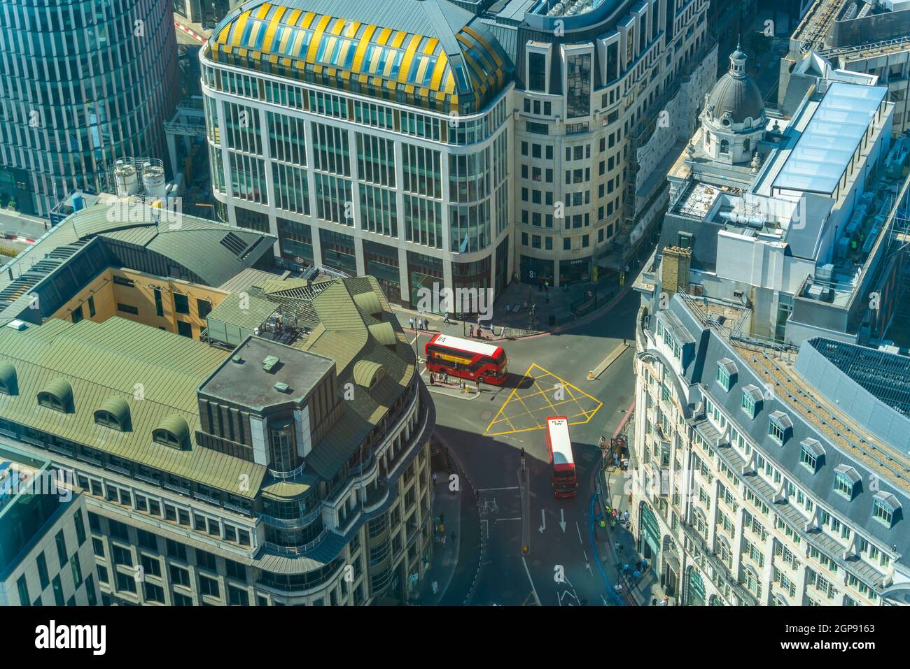 Aerial view of red bus in the City and neighbouring buildings, London, England, United Kingdom, Europe Stock Photo
