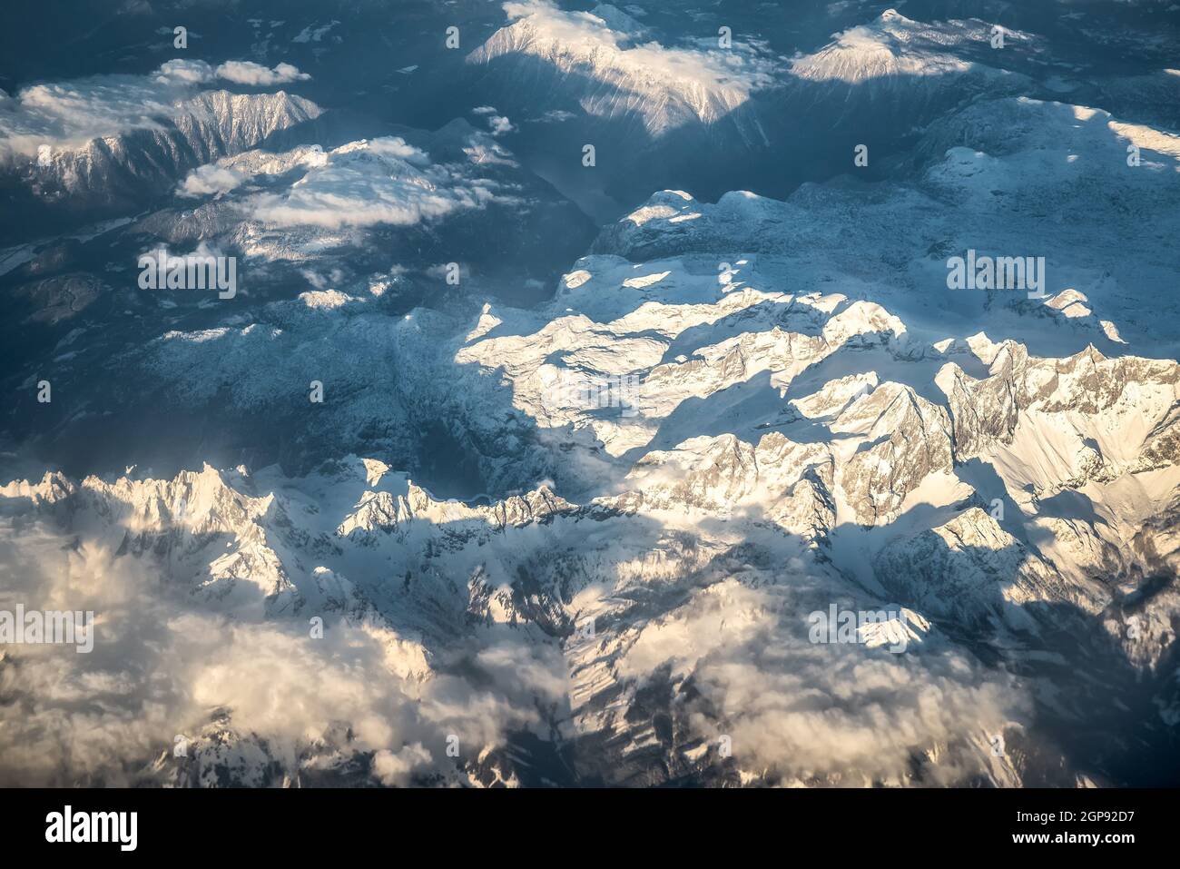 Aerial view of snow capped alps Stock Photo - Alamy